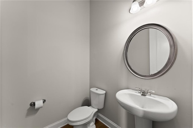 427 Dawson Pointe Pkwy, Dawsonville, GA 30534 - bathroom with a sink, toilet, and baseboards