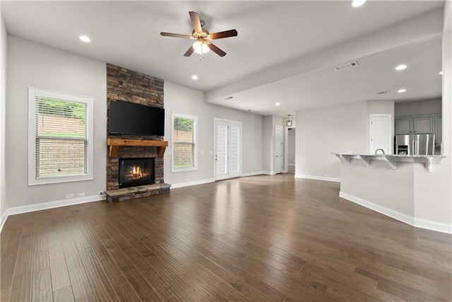 427 Dawson Pointe Pkwy, Dawsonville, GA 30534 - unfurnished living room with a ceiling fan, baseboards, a fireplace, dark wood finished floors, and recessed lighting