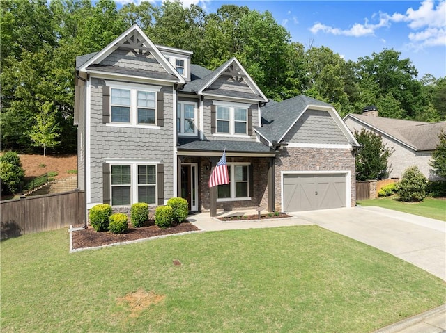 427 Dawson Pointe Pkwy, Dawsonville, GA 30534 - craftsman-style home featuring concrete driveway, a shingled roof, an attached garage, and stone siding