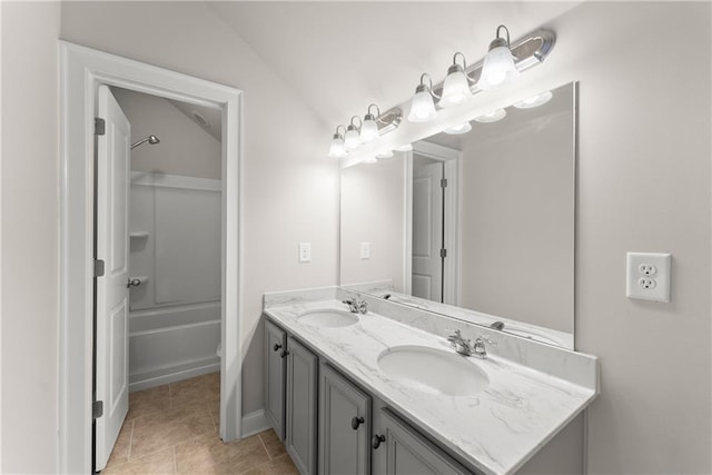 427 Dawson Pointe Pkwy, Dawsonville, GA 30534 - bathroom with double vanity, washtub / shower combination, tile patterned flooring, and lofted ceiling