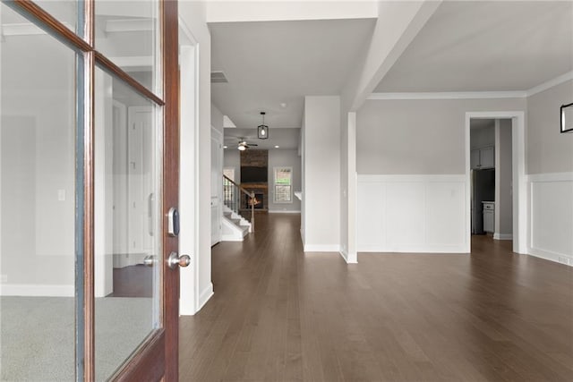 427 Dawson Pointe Pkwy, Dawsonville, GA 30534 - foyer featuring stairs, dark wood finished floors, a wainscoted wall, and ceiling fan