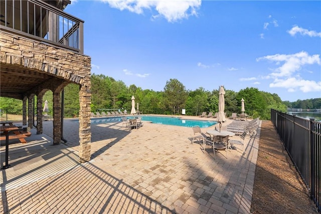 427 Dawson Pointe Pkwy, Dawsonville, GA 30534 - community pool featuring a patio and fence