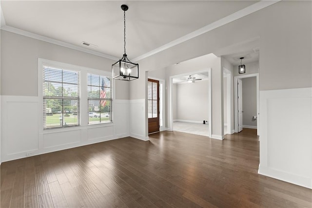 427 Dawson Pointe Pkwy, Dawsonville, GA 30534 - unfurnished dining area with wainscoting, a chandelier, wood finished floors, ornamental molding, and a ceiling fan
