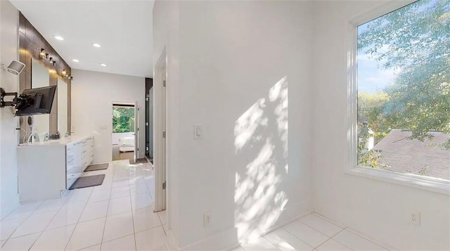 full bathroom with recessed lighting, vanity, and tile patterned floors