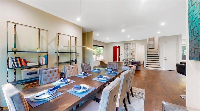 dining area featuring recessed lighting, stairway, and wood finished floors