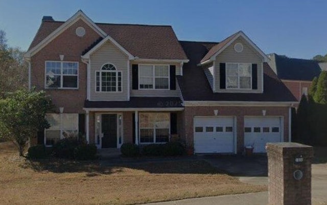 1090 Chapel Hill Dr SE, Lawrenceville, GA 30045 - traditional-style house featuring driveway, a garage, and a front lawn