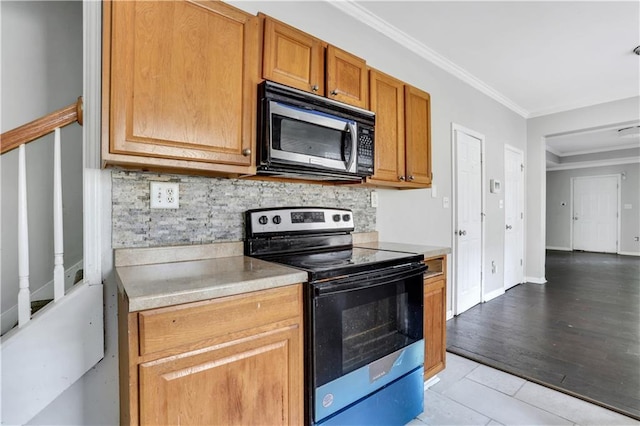 2005 Chicago Ave NW, Atlanta, GA 30314 - kitchen featuring stainless steel appliances, decorative backsplash, crown molding, light countertops, and brown cabinetry