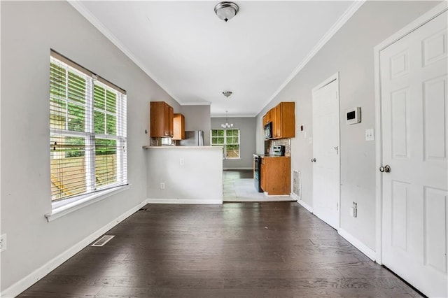 2005 Chicago Ave NW, Atlanta, GA 30314 - unfurnished living room featuring ornamental molding, dark wood finished floors, and a chandelier
