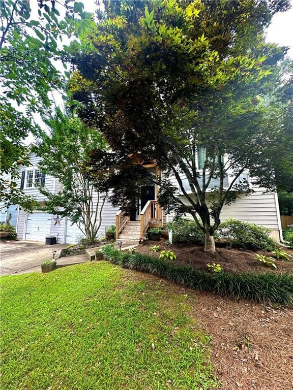 227 Bennett Farms Trl, Acworth, GA 30102 - obstructed view of property featuring a garage, driveway, and a front yard