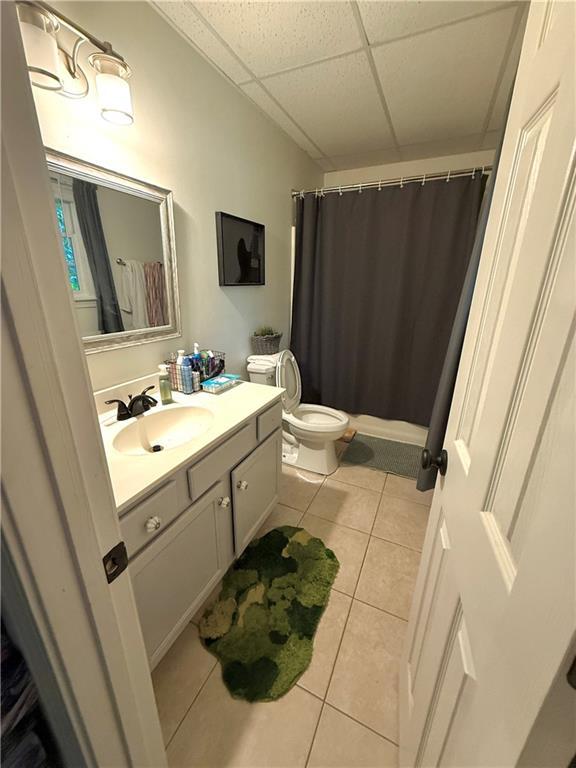 227 Bennett Farms Trl, Acworth, GA 30102 - full bathroom with a drop ceiling, tile patterned floors, vanity, and curtained shower