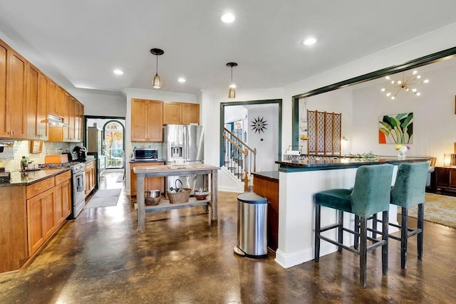 2295 Hemrick Rd, Cumming, GA 30041 - kitchen with stainless steel appliances, tasteful backsplash, a kitchen island, a kitchen breakfast bar, and recessed lighting
