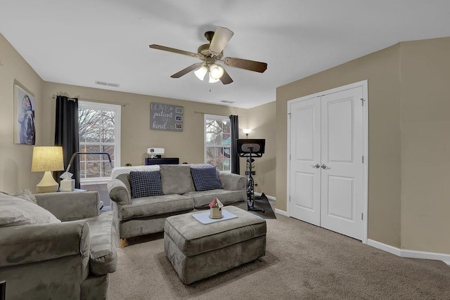 2295 Hemrick Rd, Cumming, GA 30041 - living area featuring ceiling fan, baseboards, and carpet flooring