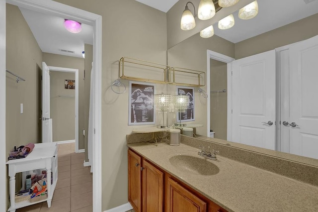 2295 Hemrick Rd, Cumming, GA 30041 - full bathroom with tile patterned floors, vanity, baseboards, and a shower