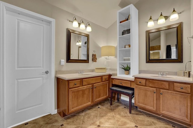 2295 Hemrick Rd, Cumming, GA 30041 - full bath featuring vaulted ceiling, two vanities, and tile patterned floors