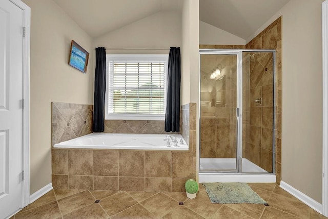 2295 Hemrick Rd, Cumming, GA 30041 - bathroom featuring tile patterned flooring, a stall shower, a garden tub, and vaulted ceiling