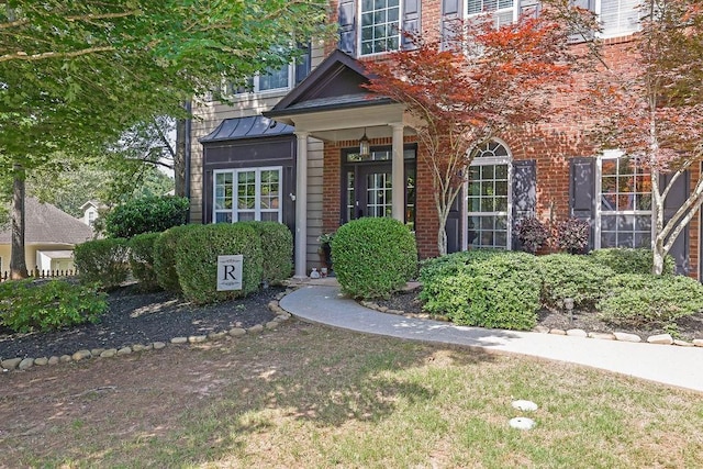 2295 Hemrick Rd, Cumming, GA 30041 - entrance to property with brick siding and a standing seam roof