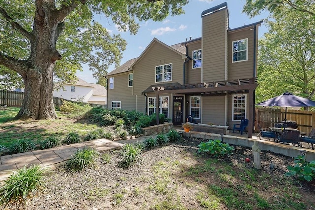 2295 Hemrick Rd, Cumming, GA 30041 - back of property with a chimney and a patio area