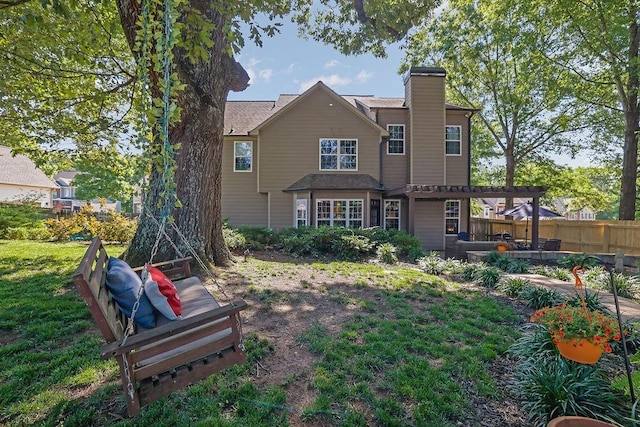2295 Hemrick Rd, Cumming, GA 30041 - back of property with a chimney, a pergola, and a patio