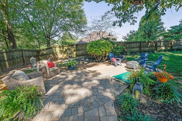 2295 Hemrick Rd, Cumming, GA 30041 - fenced backyard with a fire pit and a patio area