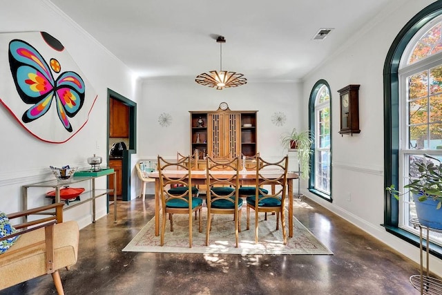 2295 Hemrick Rd, Cumming, GA 30041 - dining space featuring finished concrete floors, healthy amount of natural light, ornamental molding, and baseboards