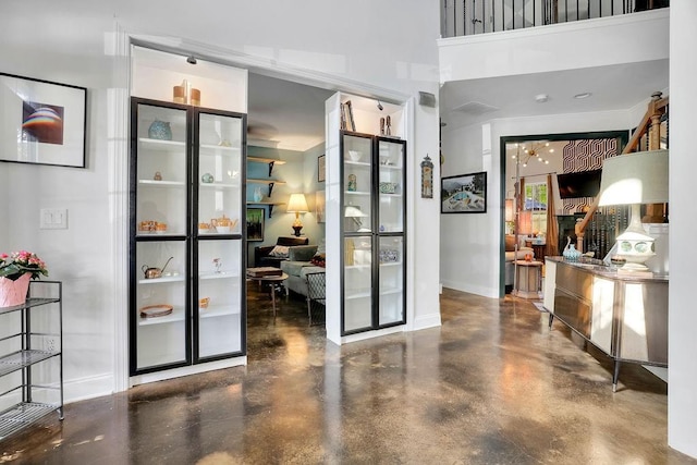 2295 Hemrick Rd, Cumming, GA 30041 - entrance foyer with baseboards and finished concrete floors