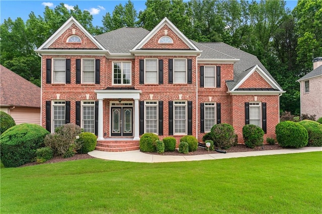 871 Windsor Creek Dr, Grayson, GA 30017 - colonial house with brick siding and a front lawn