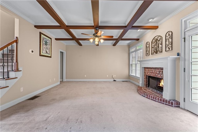 871 Windsor Creek Dr, Grayson, GA 30017 - unfurnished living room featuring carpet floors, a ceiling fan, stairway, beamed ceiling, and a brick fireplace