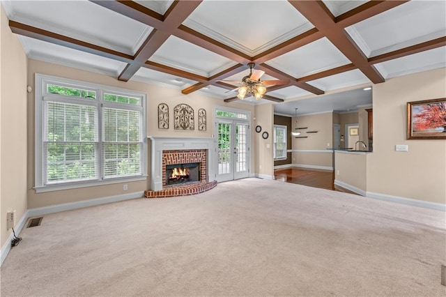 871 Windsor Creek Dr, Grayson, GA 30017 - unfurnished living room with carpet floors, a ceiling fan, a fireplace, beamed ceiling, and coffered ceiling