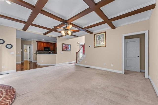 871 Windsor Creek Dr, Grayson, GA 30017 - unfurnished living room with carpet, stairway, beamed ceiling, coffered ceiling, and a ceiling fan