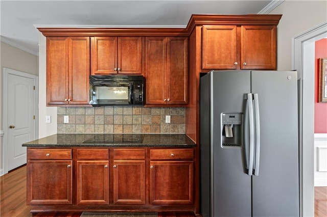 871 Windsor Creek Dr, Grayson, GA 30017 - kitchen with black appliances, crown molding, dark stone counters, decorative backsplash, and wood finished floors