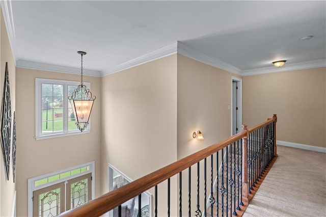 871 Windsor Creek Dr, Grayson, GA 30017 - hall featuring a chandelier, carpet floors, ornamental molding, and an upstairs landing