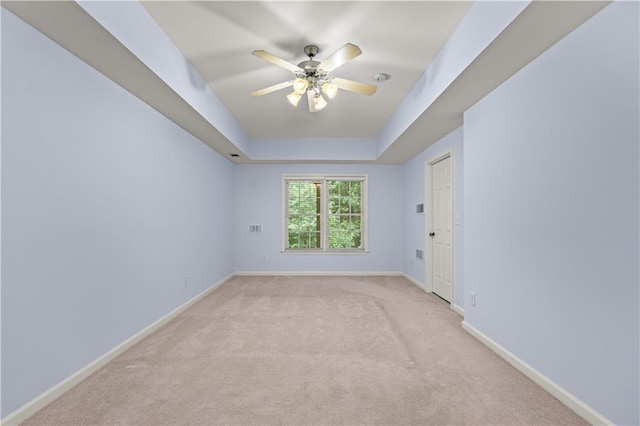 871 Windsor Creek Dr, Grayson, GA 30017 - spare room with a ceiling fan, light carpet, and a raised ceiling