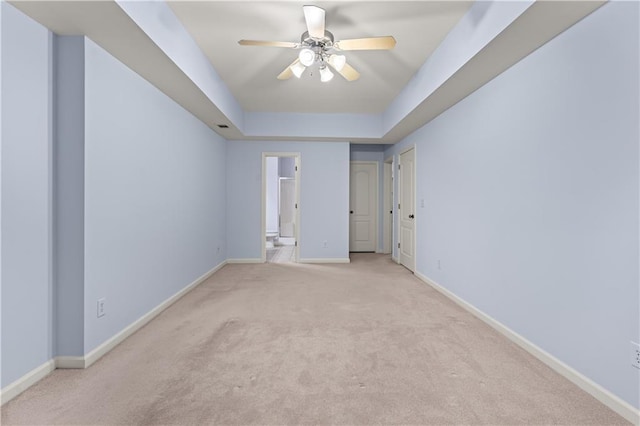 871 Windsor Creek Dr, Grayson, GA 30017 - unfurnished bedroom with light colored carpet, connected bathroom, a raised ceiling, and ceiling fan