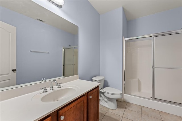 871 Windsor Creek Dr, Grayson, GA 30017 - bathroom featuring a shower stall, vanity, and tile patterned flooring