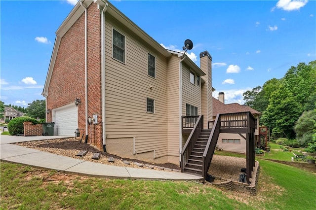 871 Windsor Creek Dr, Grayson, GA 30017 - view of side of home featuring stairs, brick siding, a wooden deck, a chimney, and a yard