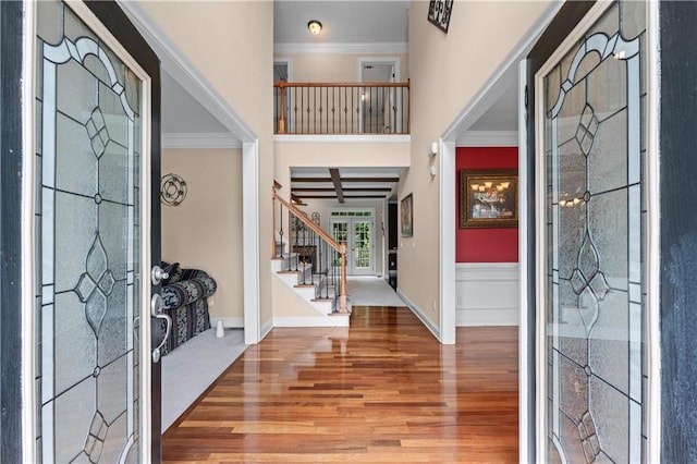 871 Windsor Creek Dr, Grayson, GA 30017 - entrance foyer featuring wood finished floors, stairway, ornamental molding, and a high ceiling