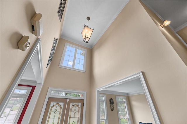 871 Windsor Creek Dr, Grayson, GA 30017 - foyer entrance with crown molding, a towering ceiling, and plenty of natural light