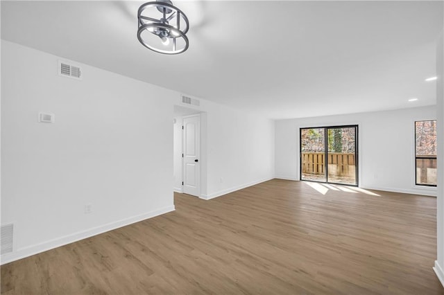 unfurnished living room with hardwood / wood-style floors