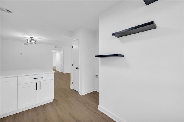 hallway featuring light hardwood / wood-style flooring