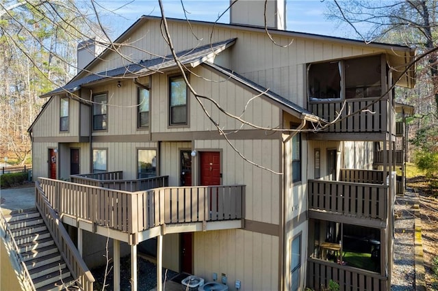 rear view of property featuring cooling unit