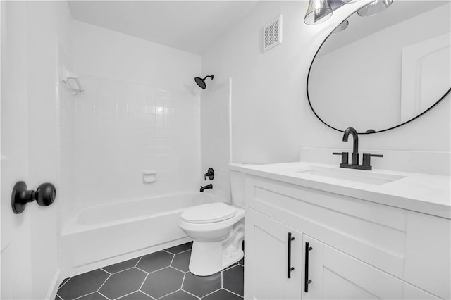 full bathroom with tiled shower / bath combo, vanity, tile patterned flooring, and toilet