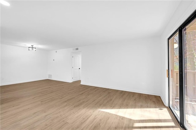 unfurnished room featuring light hardwood / wood-style flooring