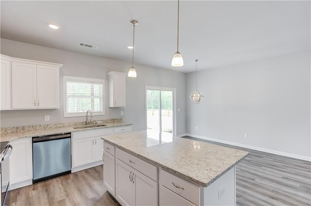 kitchen with stainless steel dishwasher, a kitchen island, white cabinetry, and hanging light fixtures