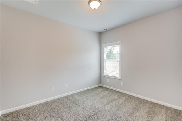 empty room with carpet flooring