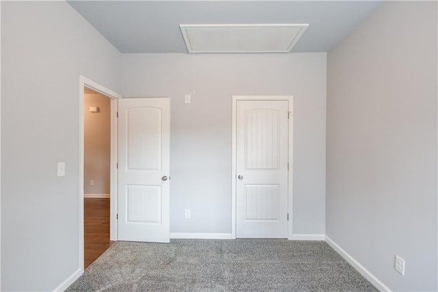 unfurnished bedroom featuring a closet and carpet floors