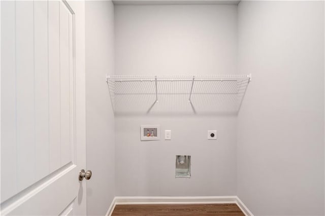 laundry room with washer hookup, dark wood-type flooring, and electric dryer hookup