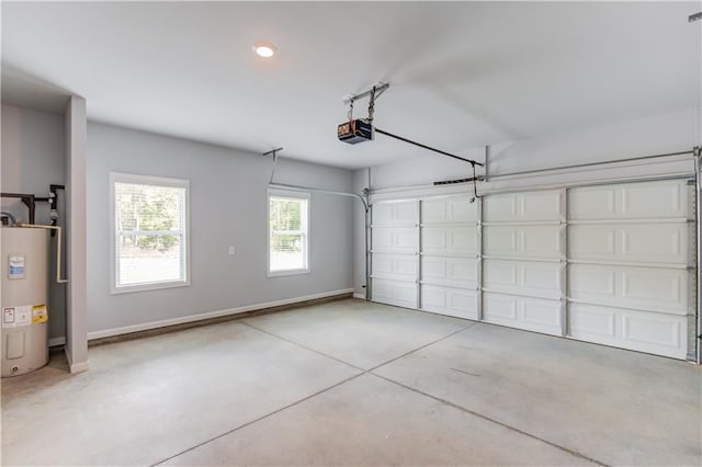 garage with electric water heater and a garage door opener