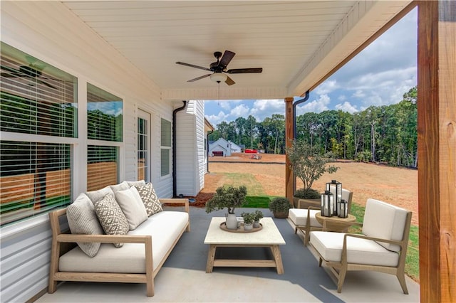 view of patio featuring an outdoor hangout area and ceiling fan