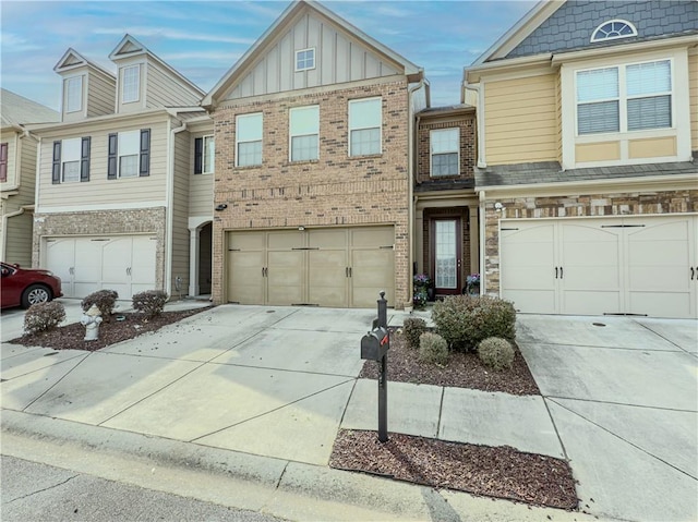 3318 Sardis Bend Dr, Buford, GA 30519 - view of property with driveway, an attached garage, board and batten siding, and brick siding