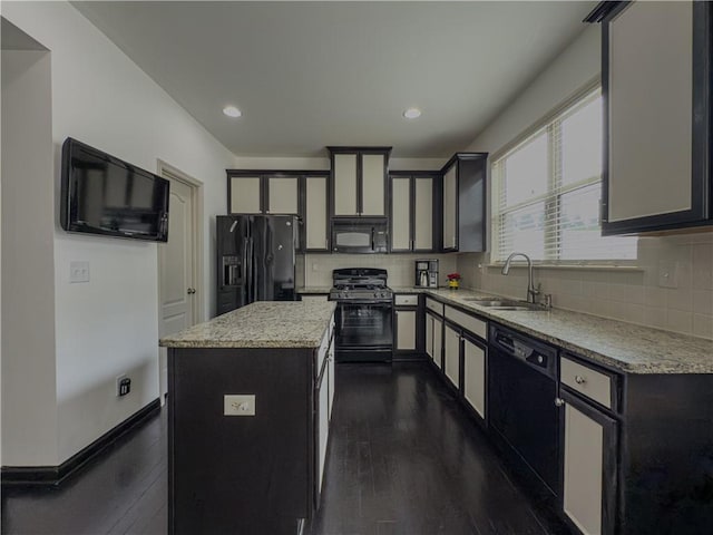 3318 Sardis Bend Dr, Buford, GA 30519 - kitchen with black appliances, a sink, a center island, decorative backsplash, and recessed lighting